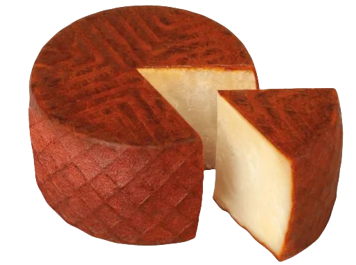 Un queso majorero con el corte de una cuña